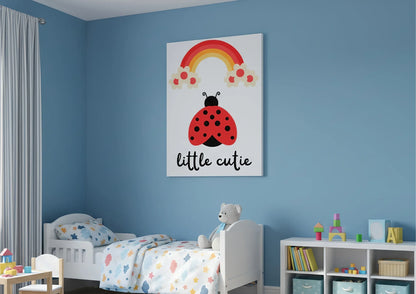 Children's room with a colorful wall art of a ladybug and rainbow above a bed.