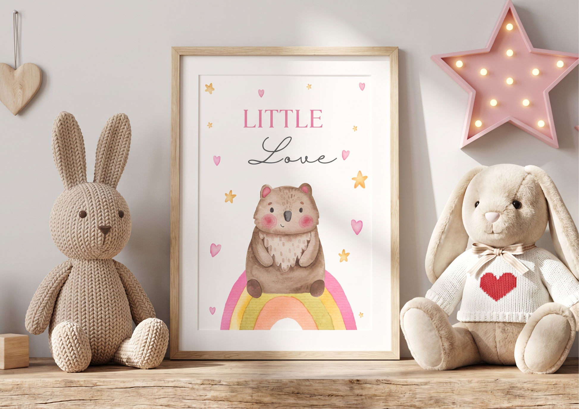 Children's room decor with framed illustration, knitted bunny, and plush toys.