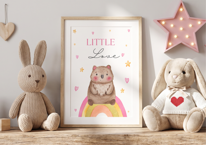 Children's room decor with framed illustration, knitted bunny, and plush toys.