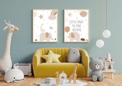 A set of two framed art prints with elephants and the quote "Little ones to him belong" on a blue wall in a child's playroom with a yellow armchair.