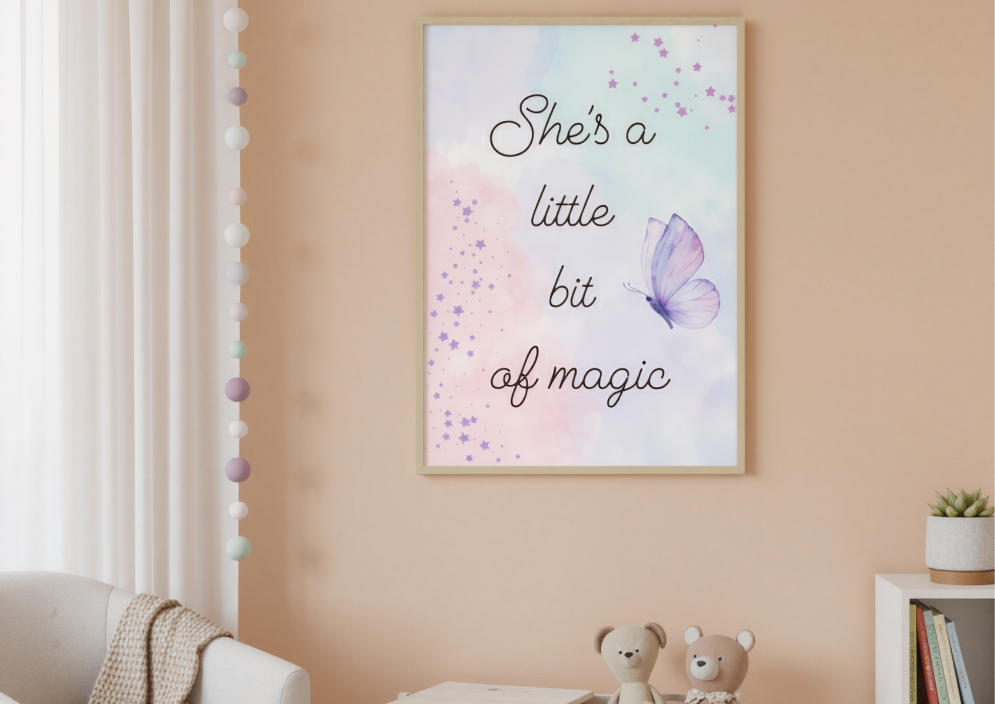 
A nursery with soft, pastel orange walls. A framed art print with a watercolor background and the words "She's a little bit of magic" is hanging above a wooden toy box. Two small teddy bears are sitting on top of the toy box. To the left, a portion of a white armchair with a knitted blanket is visible, and on the right, a plant sits on a white shelf.