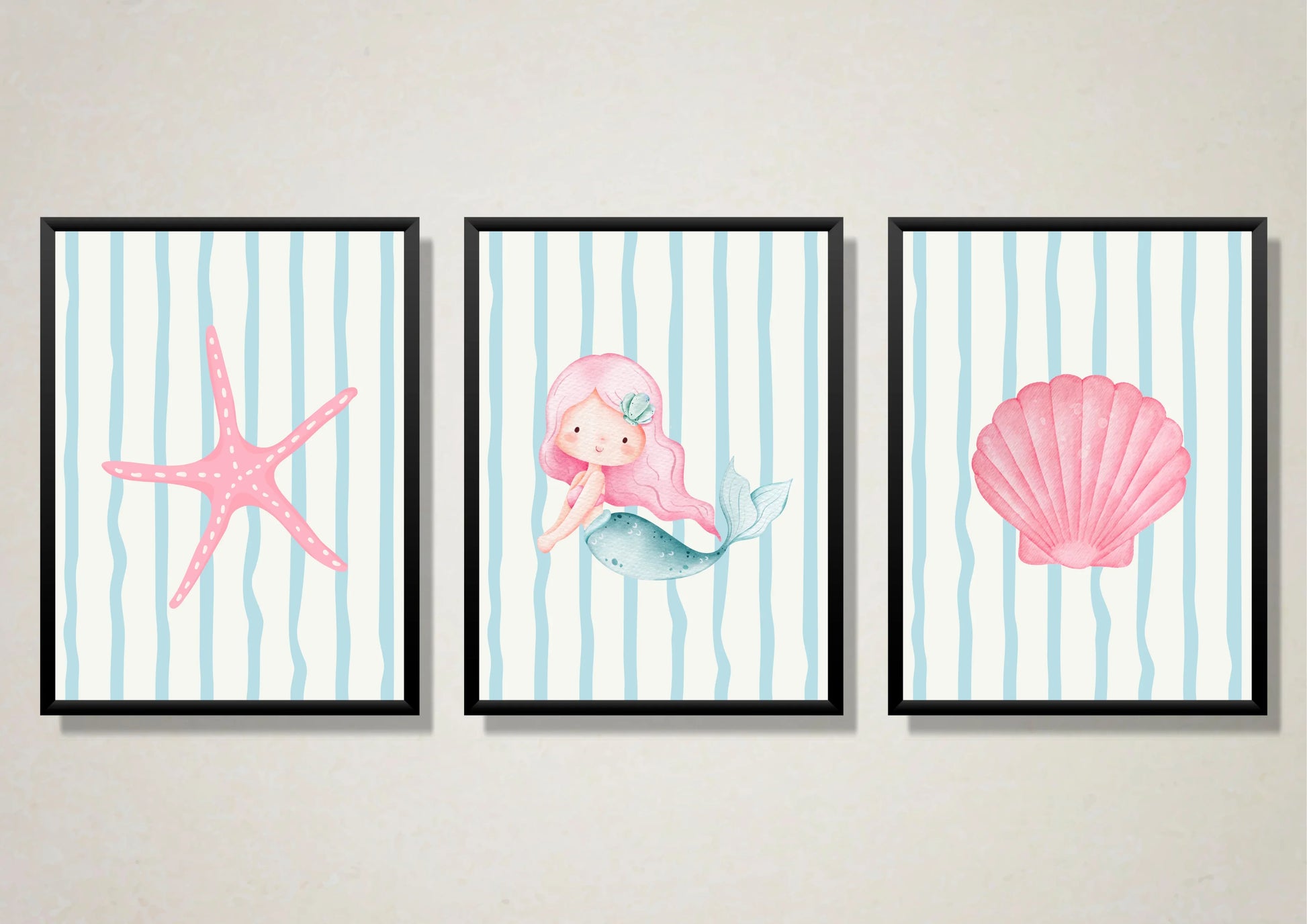 Three framed artworks featuring a mermaid, starfish, and shell on a striped background.