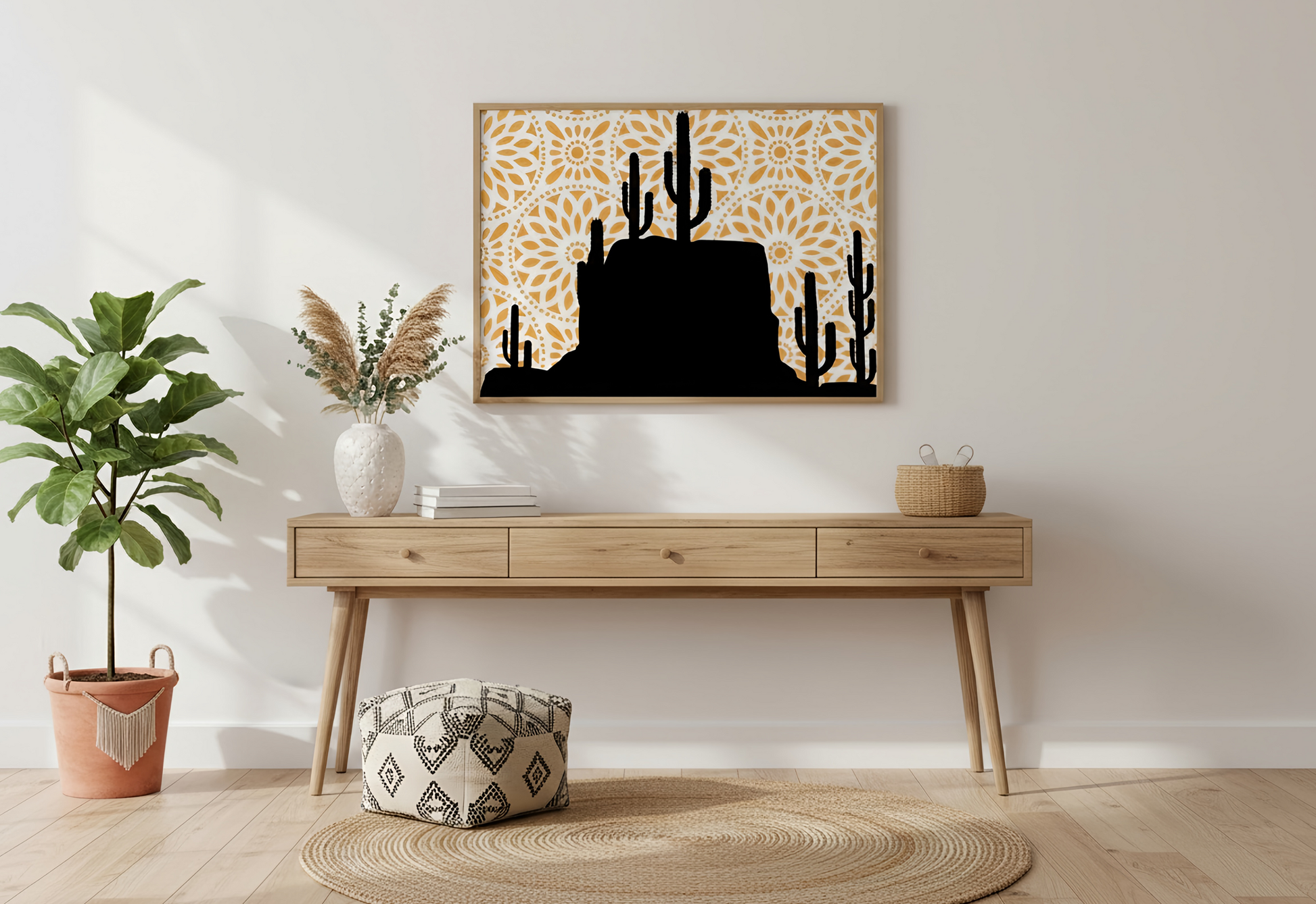 Wooden console table with decorative items against a white wall, featuring a framed artwork of cacti.