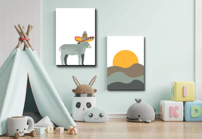 A bright playroom or nursery with pale mint green walls. Two canvas prints hang side-by-side: one of a gray donkey wearing a large sombrero, and one of a minimalist yellow sun setting over rolling brown and gray hills. In the foreground are several children's items, including a light blue teepee on the left, a storage container with a stuffed rabbit peeking out, and soft plush toys, including a gray whale and a white cloud.
