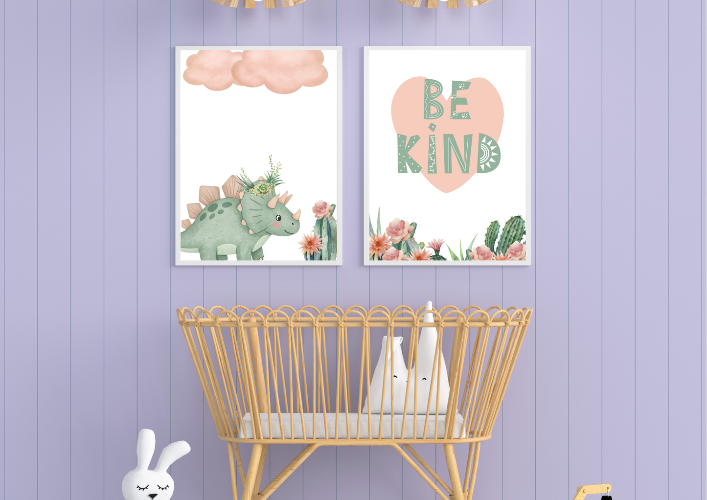 Mint Pink Dino Nursery Wall Art Set prints centered above a rattan crib against a soft lavender wall.