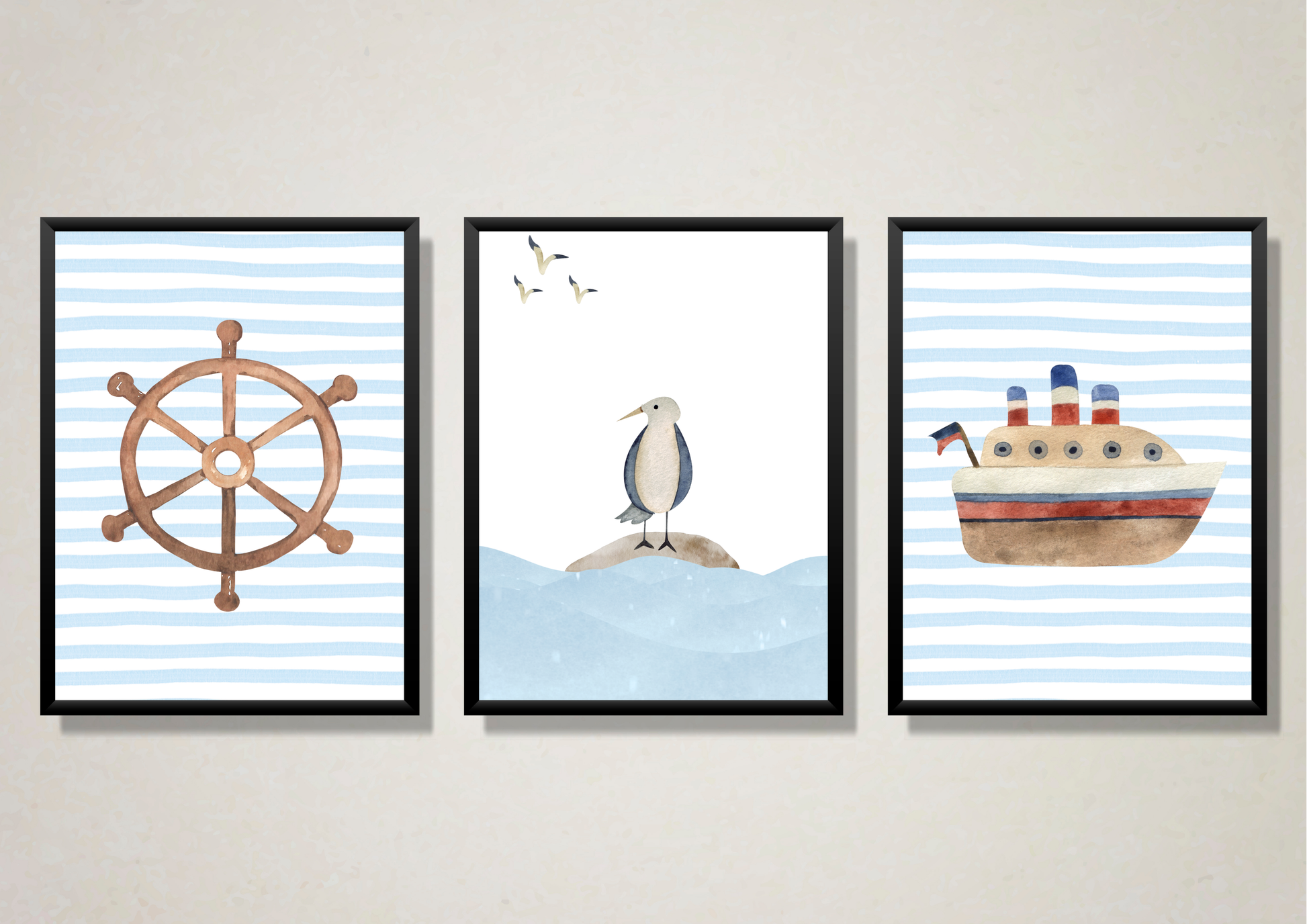 Three framed nautical-themed wall art prints hanging on a light beige wall. The left print shows a brown ship's wheel on a light blue and white striped background.