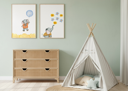 A nursery scene with mint green walls featuring a three-drawer woven rattan dresser and a striped canvas teepee with pale blue and cream pillows. Two watercolor elephant prints are displayed above the dresser, one featuring an elephant with a blue balloon and the other blowing hearts and flowers.