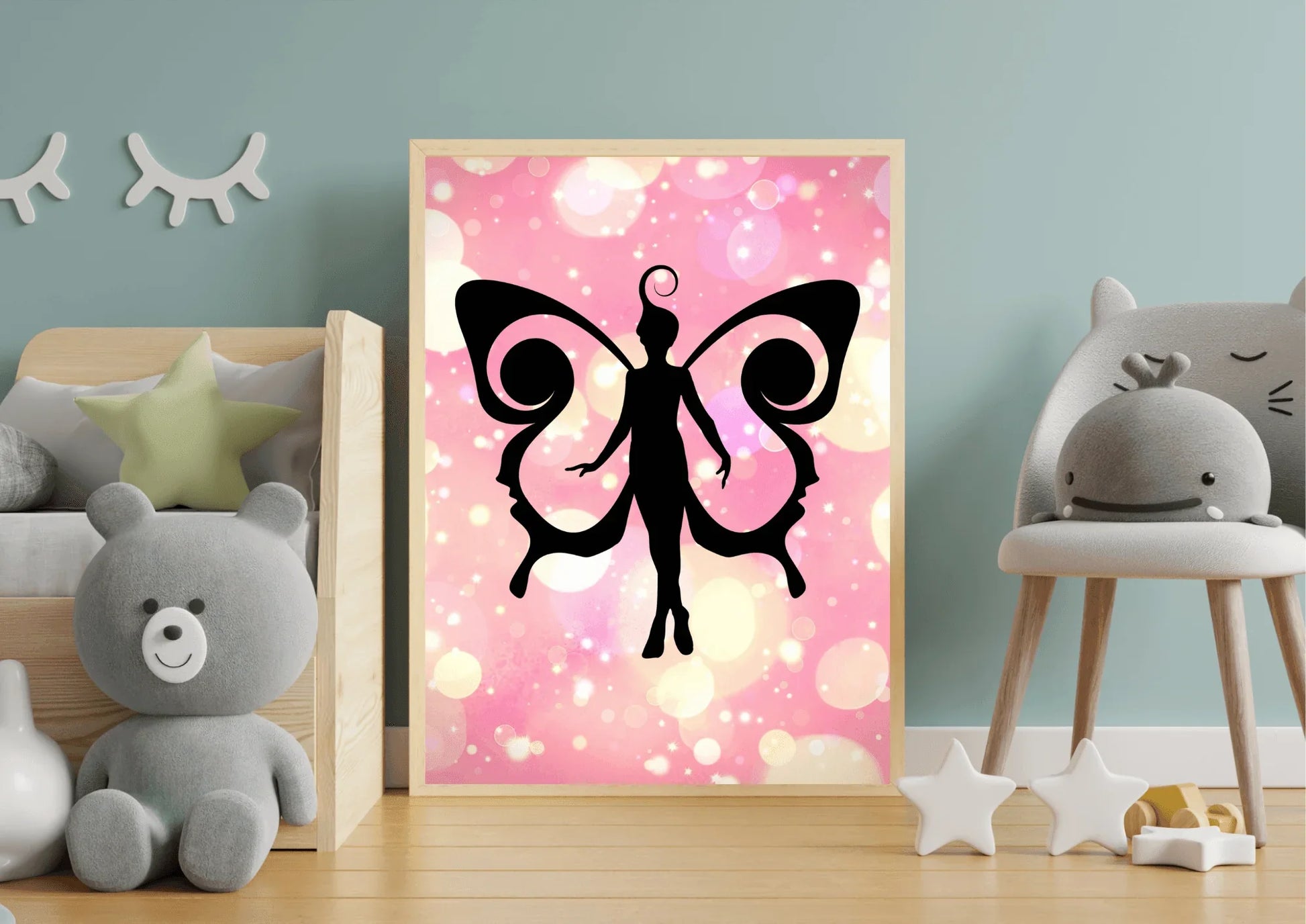 Framed artwork of a black pixy fairy silhouette on a pink background in a child's room.