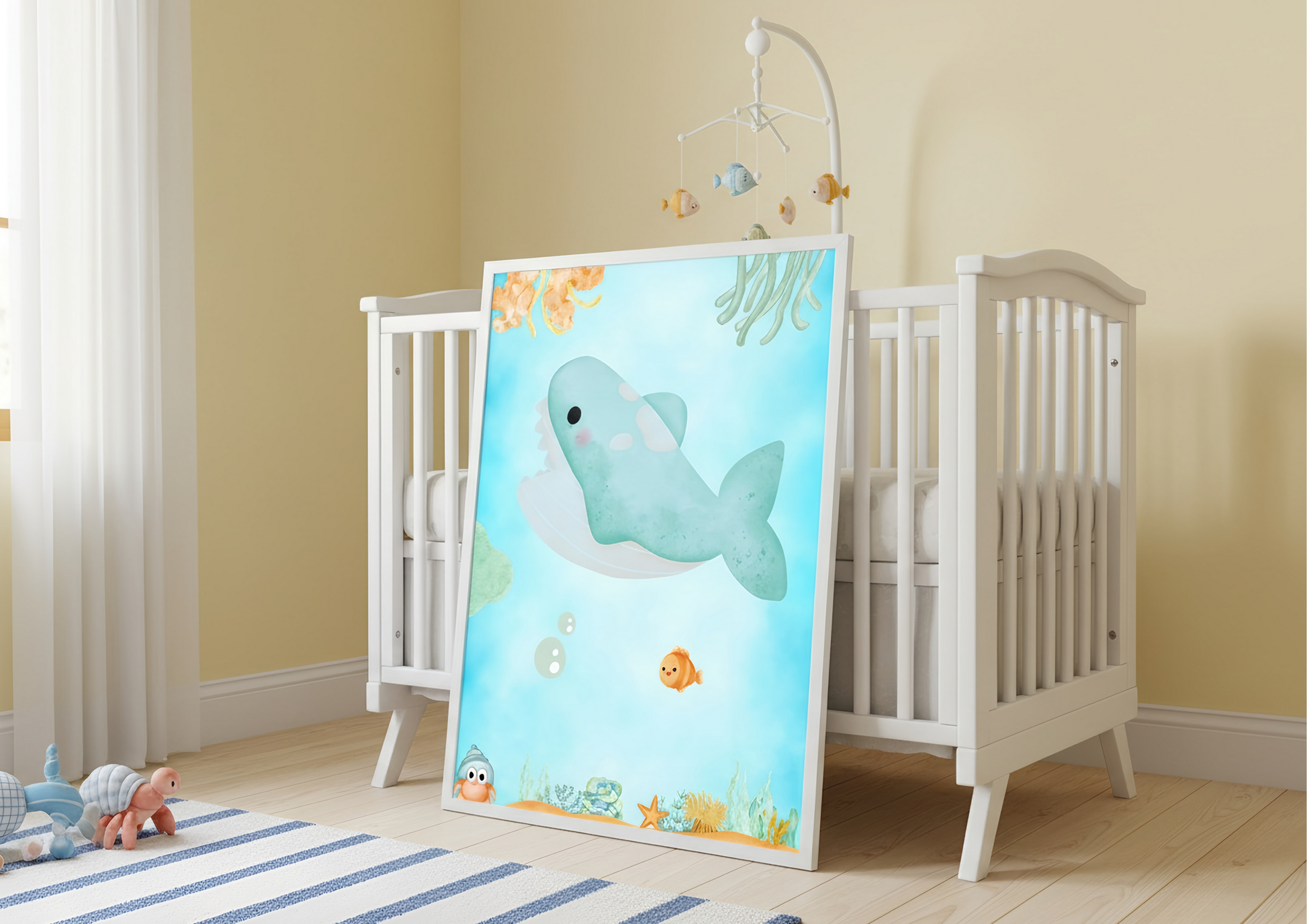 Baby crib with a decorative mirror featuring a whale design in a nursery setting.