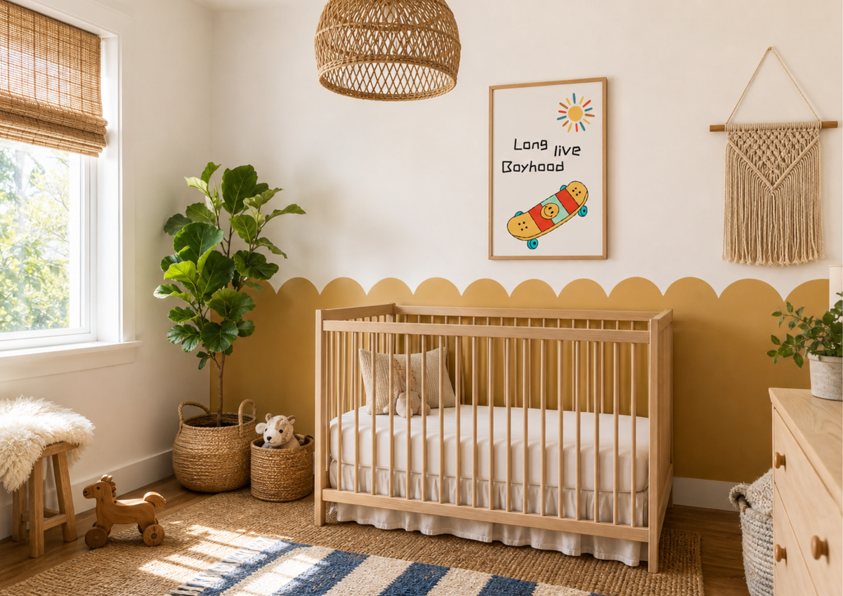 A styled nursery room featuring a light wood crib with white bedding, a yellow painted lower wall with a scalloped border, a framed 'Long live Boyhood' poster, a woven pendant light, and a potted fiddle-leaf fig plant.