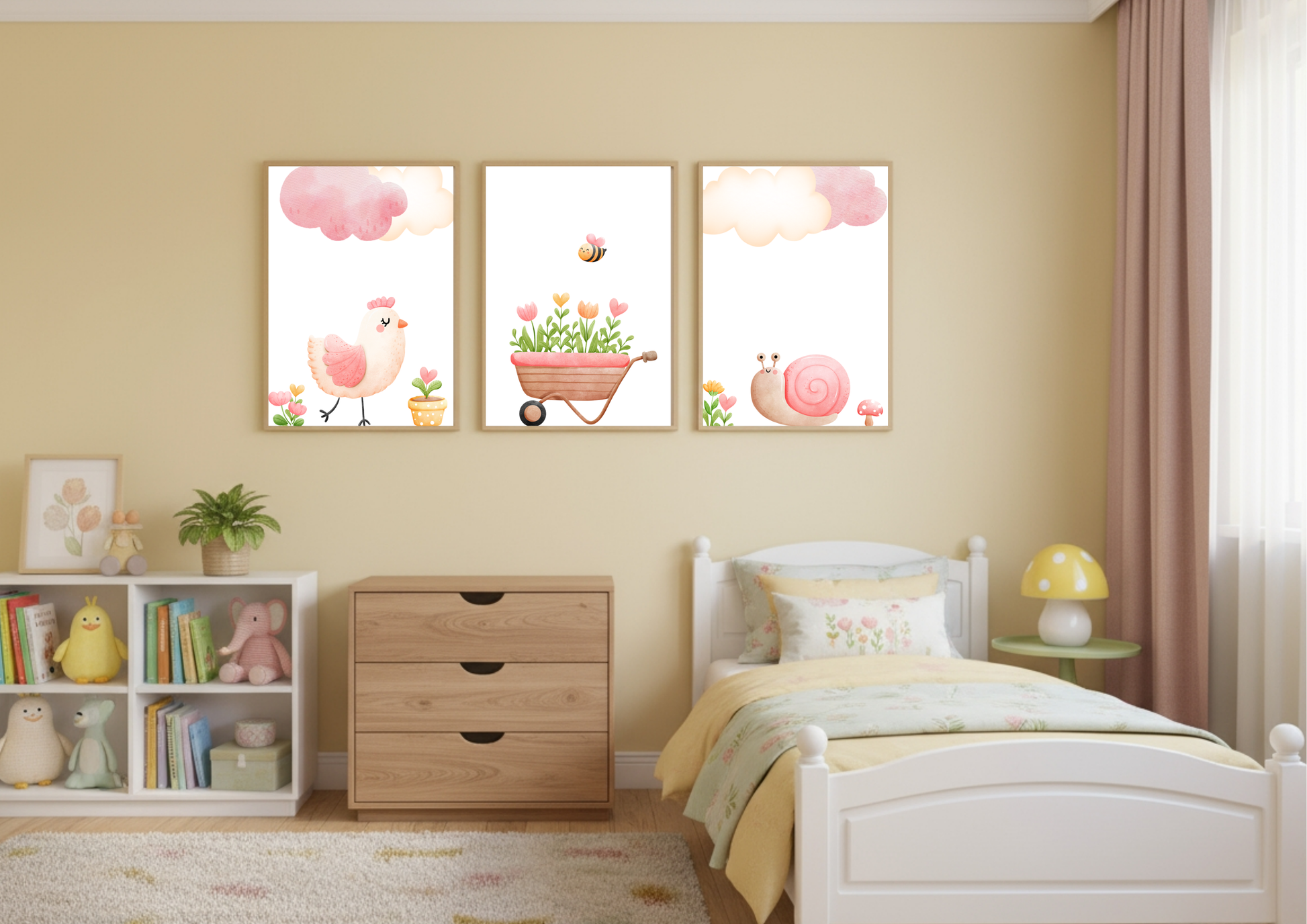 A set of three charming watercolor nursery prints displayed over a white chest of drawers and a child's white wooden bed with yellow bedding. The yellow-walled room features a cube shelf filled with toys and books, and a yellow mushroom lamp. The prints feature a pink chick, a wheelbarrow of flowers with a bee, and a pink snail, all beneath pink clouds.