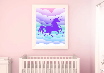 A framed art print of a purple unicorn silhouette on a pink wall above a baby's crib.
