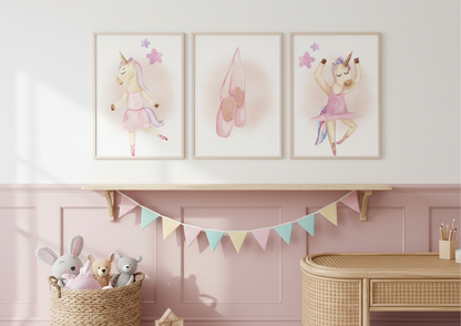 Three framed illustrations of ballerinas on a wall above a shelf with toys and a basket.