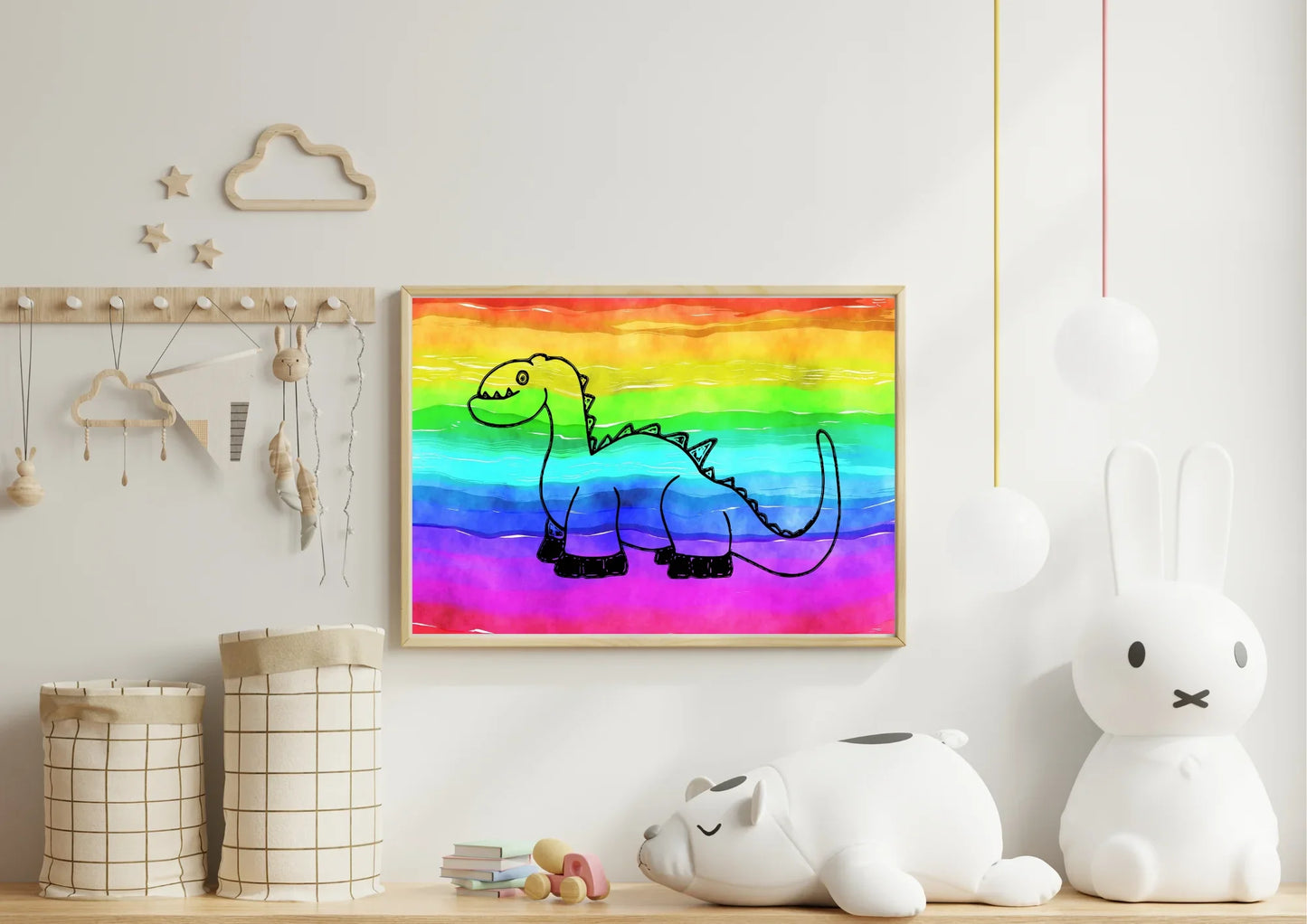 Framed drawing of a dinosaur on a rainbow background in a child's room.