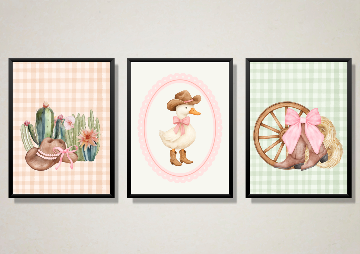 Three framed illustrations on a wall, featuring a cactus, a duck, and a wagon wheel with a bow.