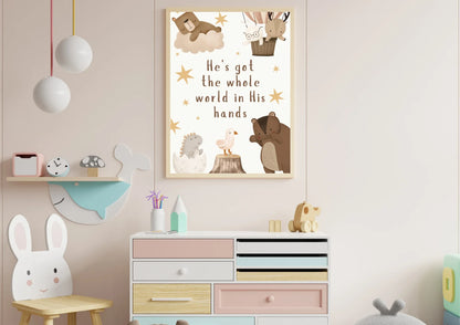 Children's room with a dresser, toys, and a religious themed print on the wall.