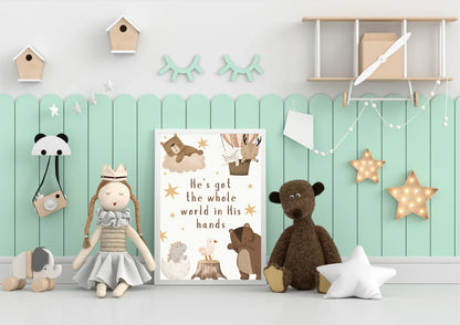 Children's room with toys, a poster, and religious a nursery print against a light green wall.